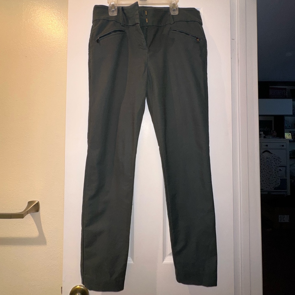 Green slacks with zipper pockets